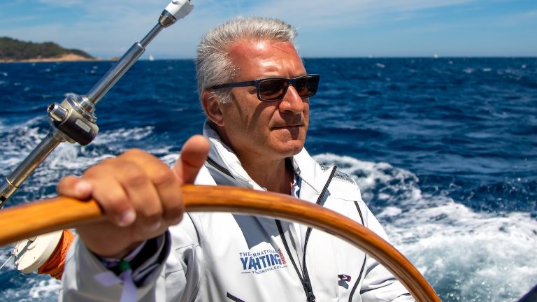 Luca D'Ambrosio founder of The International Yachting Media at the helm during a regatta